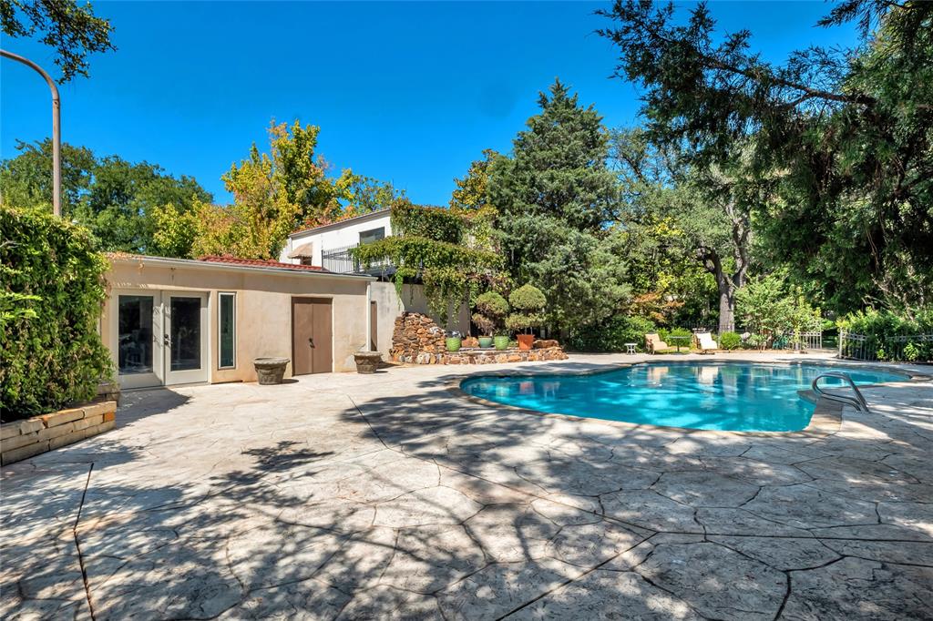 9909 Preston Road Dallas, TX 75230 - Photo 20 of 22 a view of a house with a yard