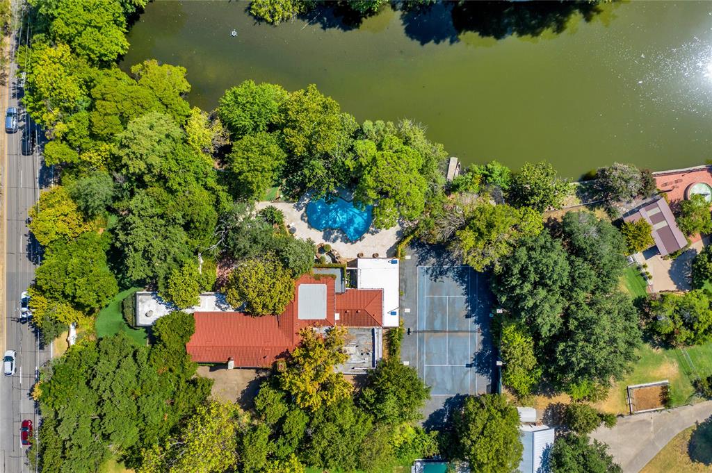 9909 Preston Road Dallas, TX 75230 - Photo 6 of 22 an aerial view of a house with a yard swimming pool outdoor seating and yard