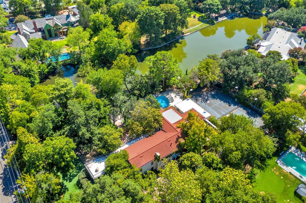 9909 Preston Road Dallas, TX 75230 - Photo 10 of 22 an aerial view of a house with a yard and lake view