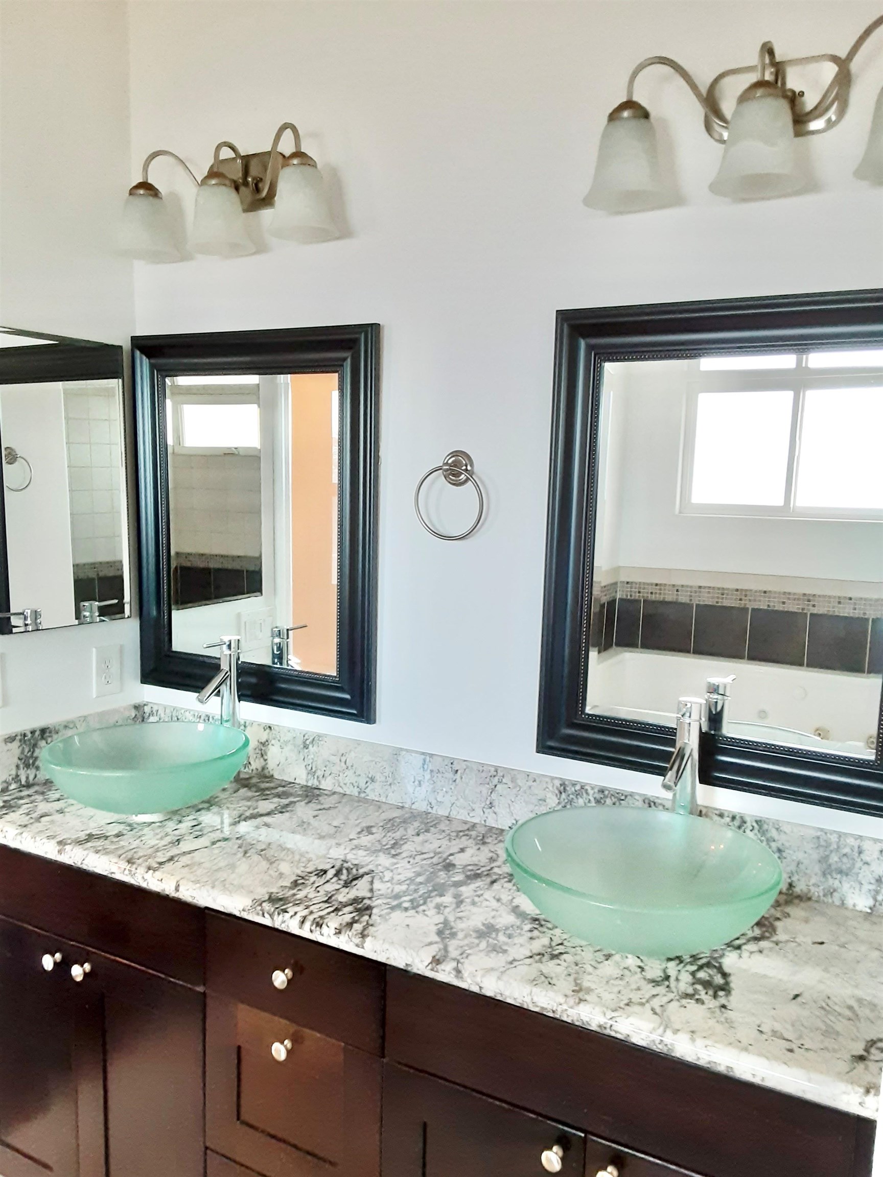 80 Koani Loop Wailuku, HI 96793 - Photo 15 of 18 a bathroom with a granite countertop sink and a mirror