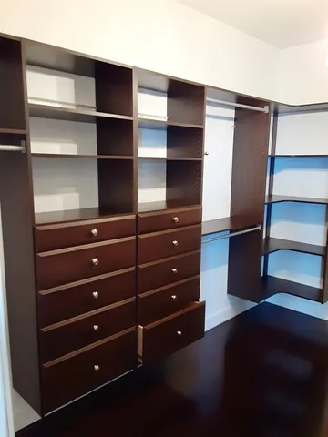 a utility room with cabinets washer and dryer