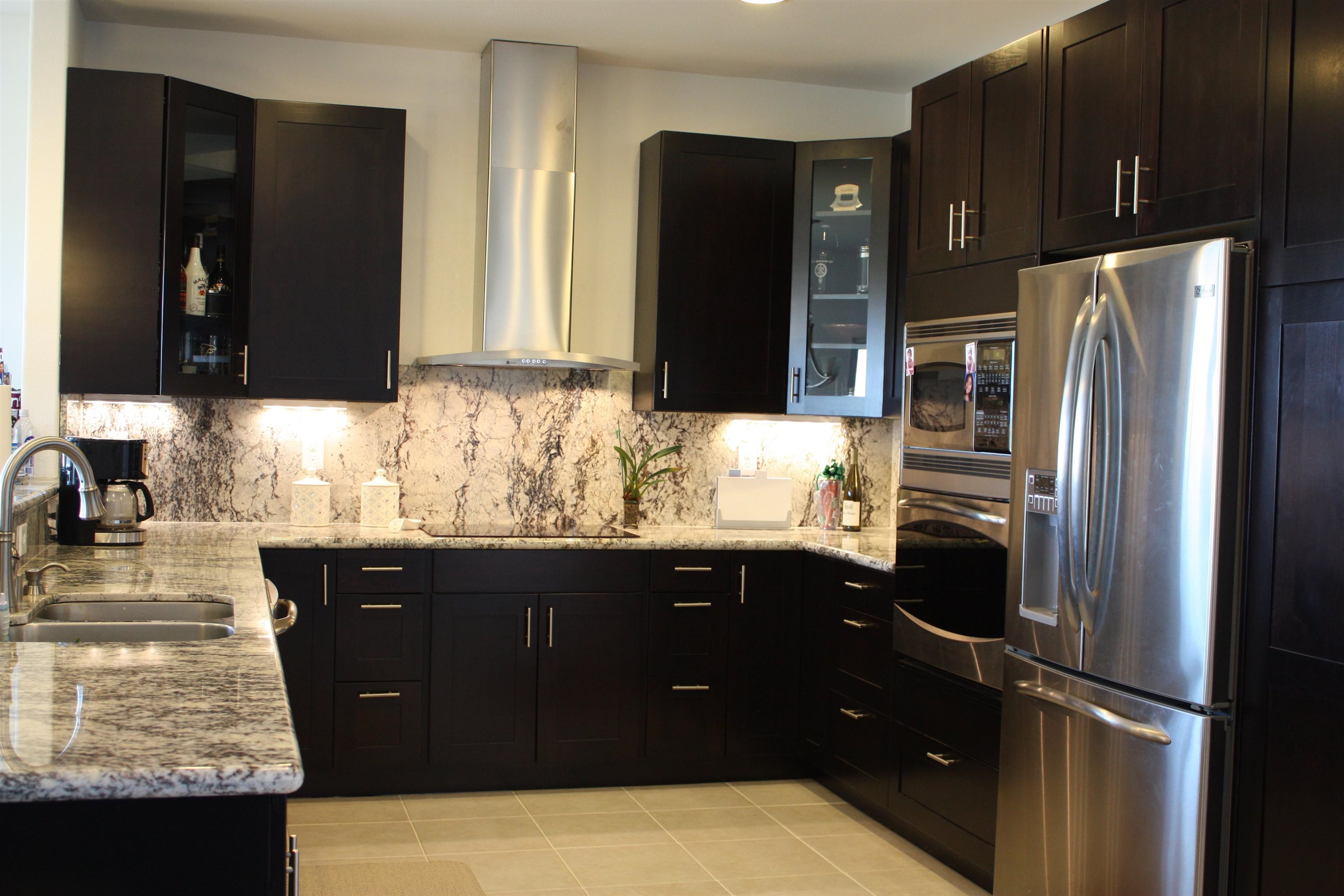 80 Koani Loop Wailuku, HI 96793 - Photo 9 of 18 a kitchen with a sink a refrigerator and cabinets