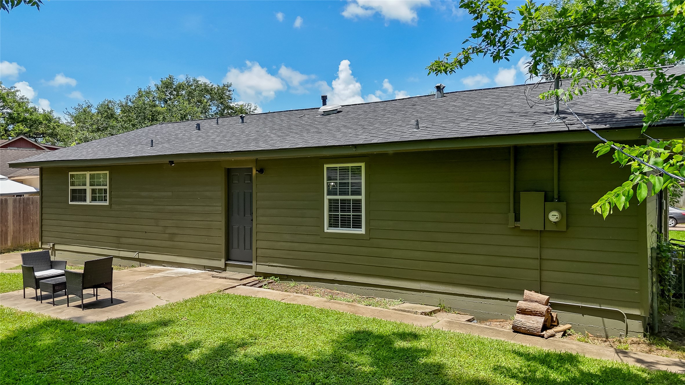 117 Cannon Street Clute, TX 77531 - Photo 20 of 24 The backyard patio area offers a spot for outdoor seating, grilling or relaxing, with a spacious yard surrounding the back of the home.