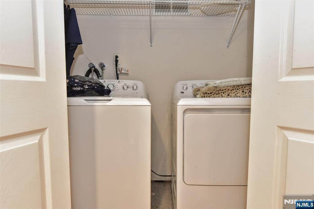 60 Dimmig Road Upper Saddle River, NJ 07458 - Photo 36 of 40 a utility room with dryer and washer