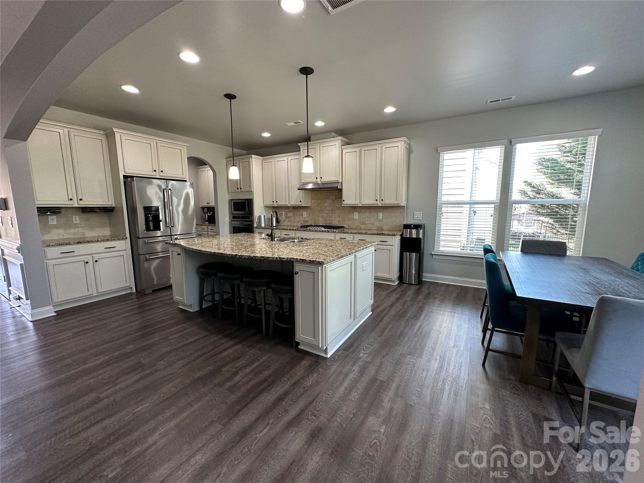 1004 Fallondale Road Waxhaw, NC 28173 - Photo 9 of 42 a large kitchen with a table and chairs in it