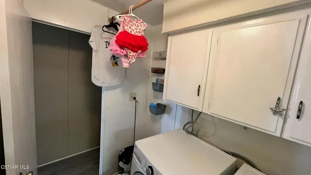 a bathroom with a sink and mirror with bathtub