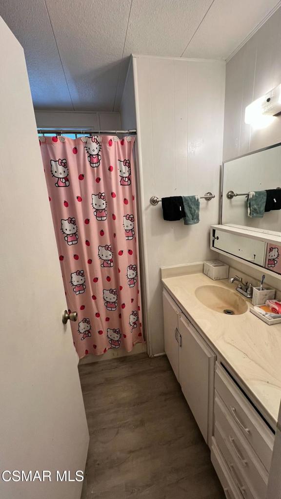 1550 Rory Lane, Unit 20 Simi Valley, CA 93063 - Photo 8 of 13 a bathroom with a sink and a mirror