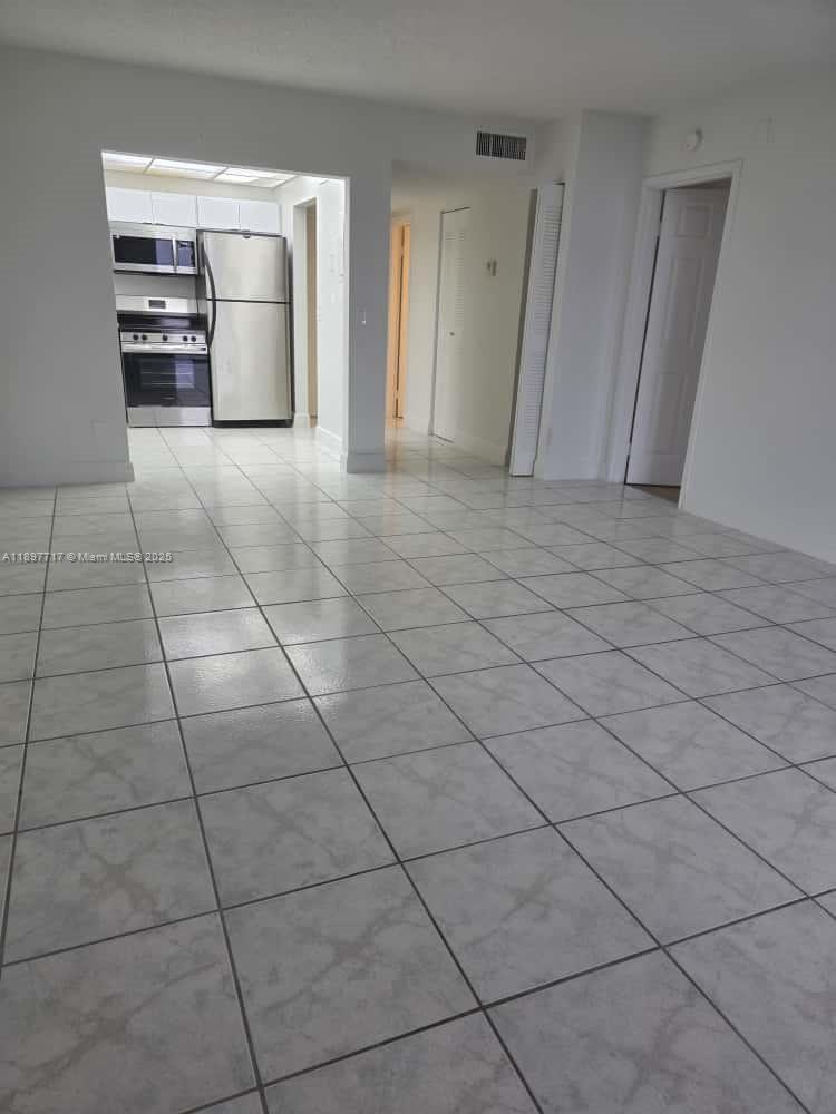 13499 Biscayne Boulevard, Unit 811 North Miami, FL 33181 - Photo 13 of 20 a view of hallway with cabinets