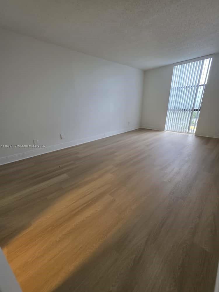 13499 Biscayne Boulevard, Unit 811 North Miami, FL 33181 - Photo 6 of 20 a view of an empty room with a window