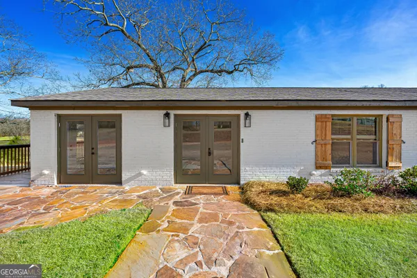 front view of a house with a yard