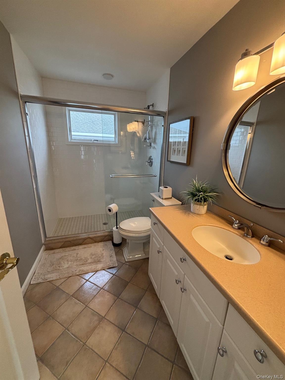 939 Dune Road West Hampton Dunes, NY 11978 - Photo 15 of 25 a bathroom with a sink mirror vanity and toilet