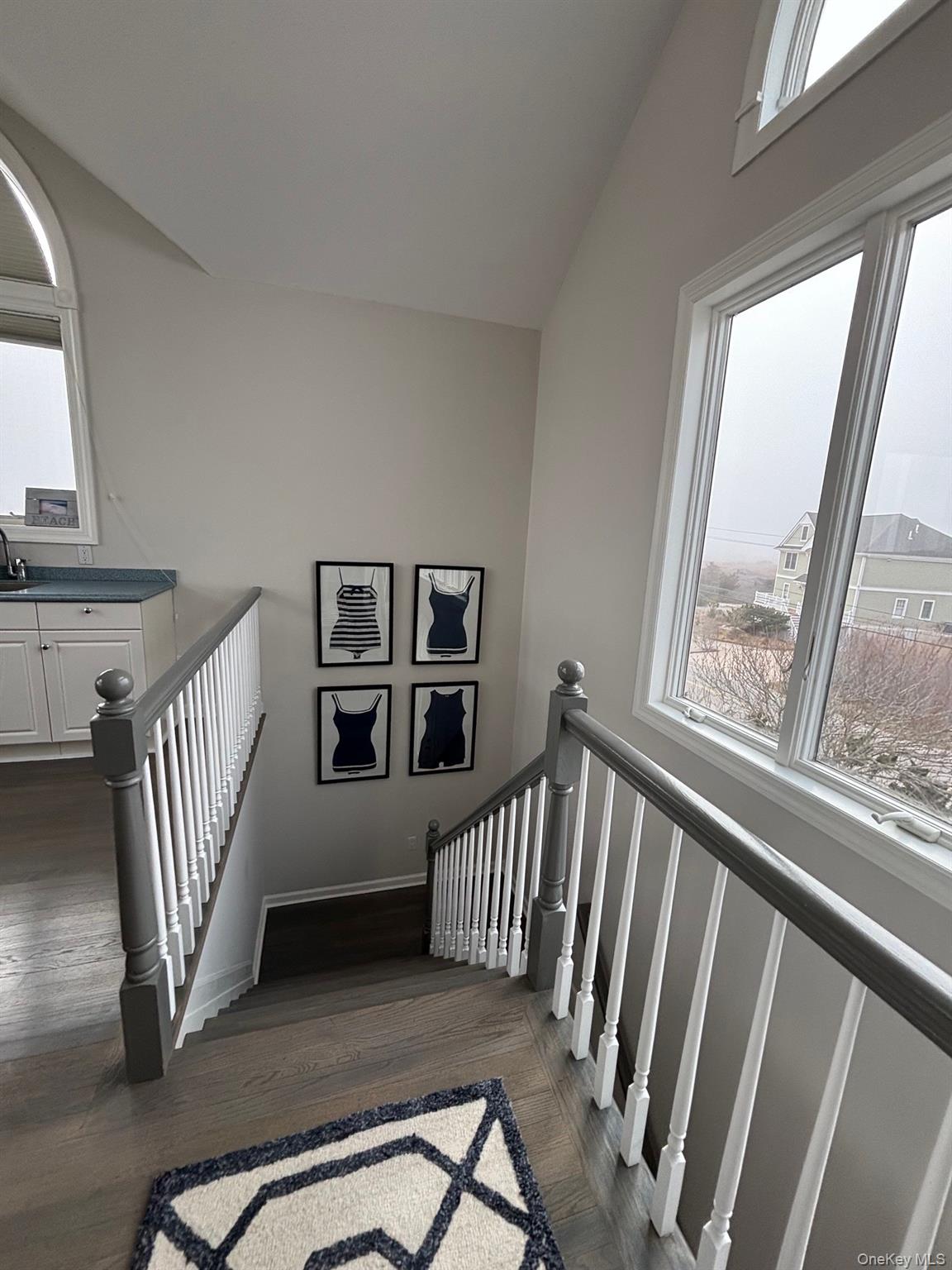 939 Dune Road West Hampton Dunes, NY 11978 - Photo 17 of 25 a view of wooden floor and windows in a room
