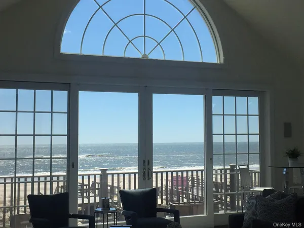a stove top oven sitting next to a large window