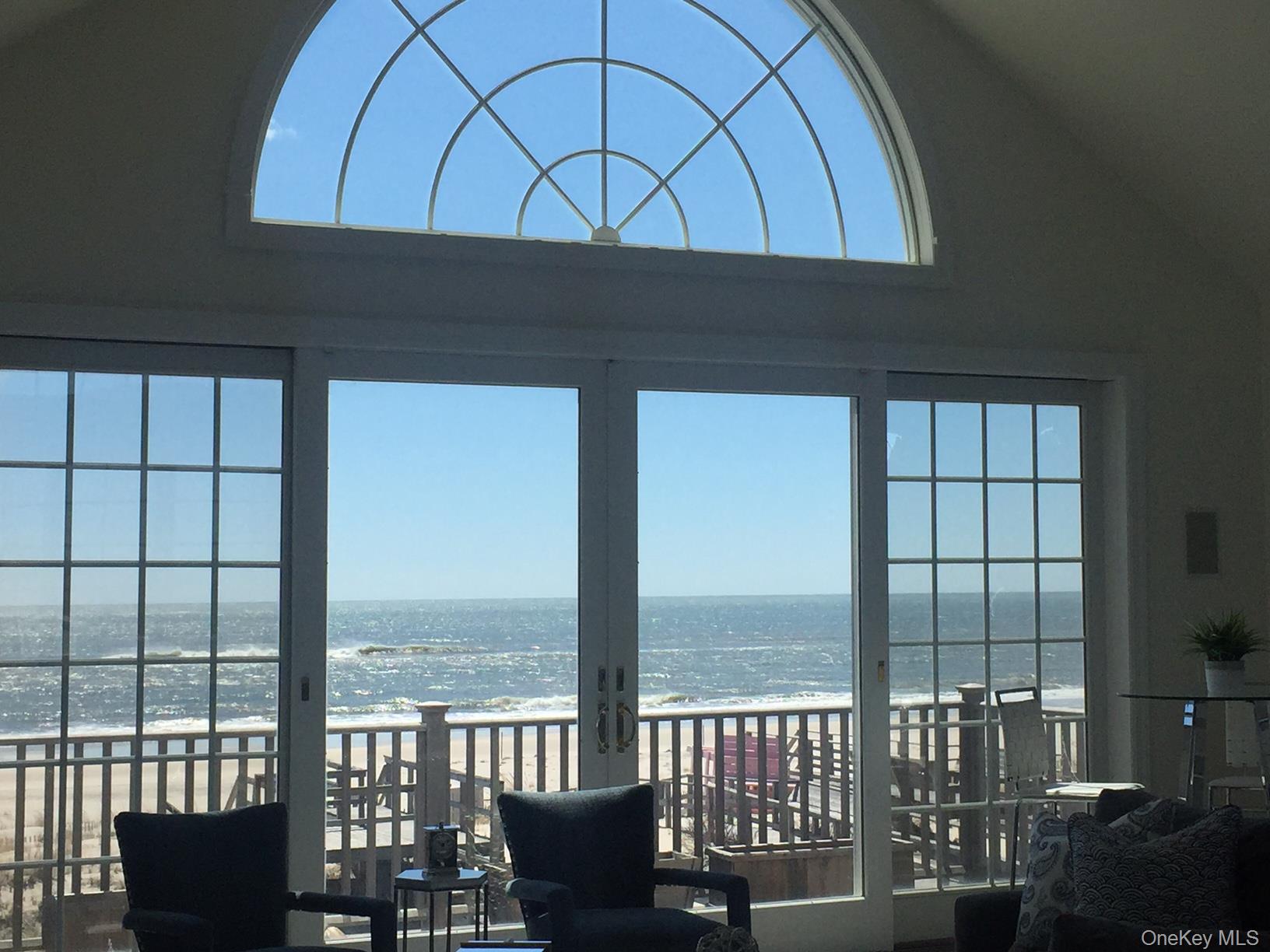 939 Dune Road West Hampton Dunes, NY 11978 - Photo 18 of 21 a stove top oven sitting next to a large window
