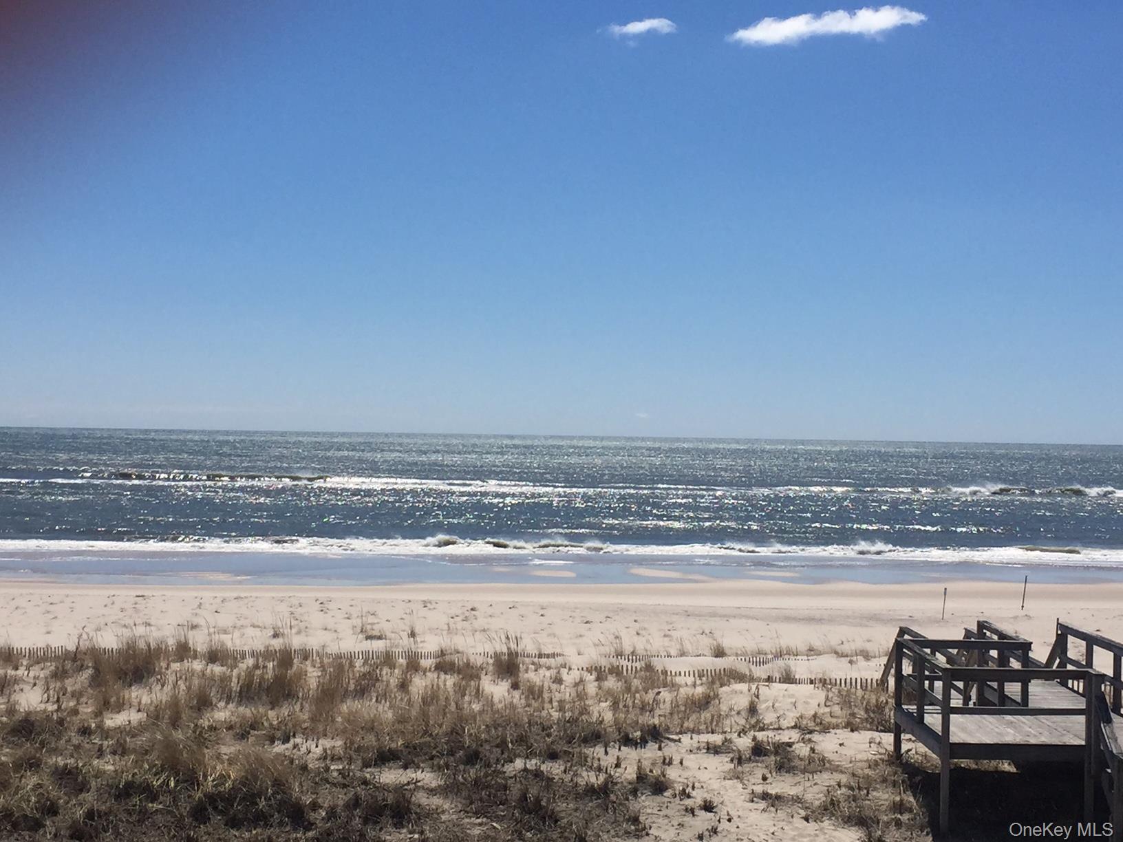 939 Dune Road West Hampton Dunes, NY 11978 - Photo 20 of 21 a view of an ocean and beach