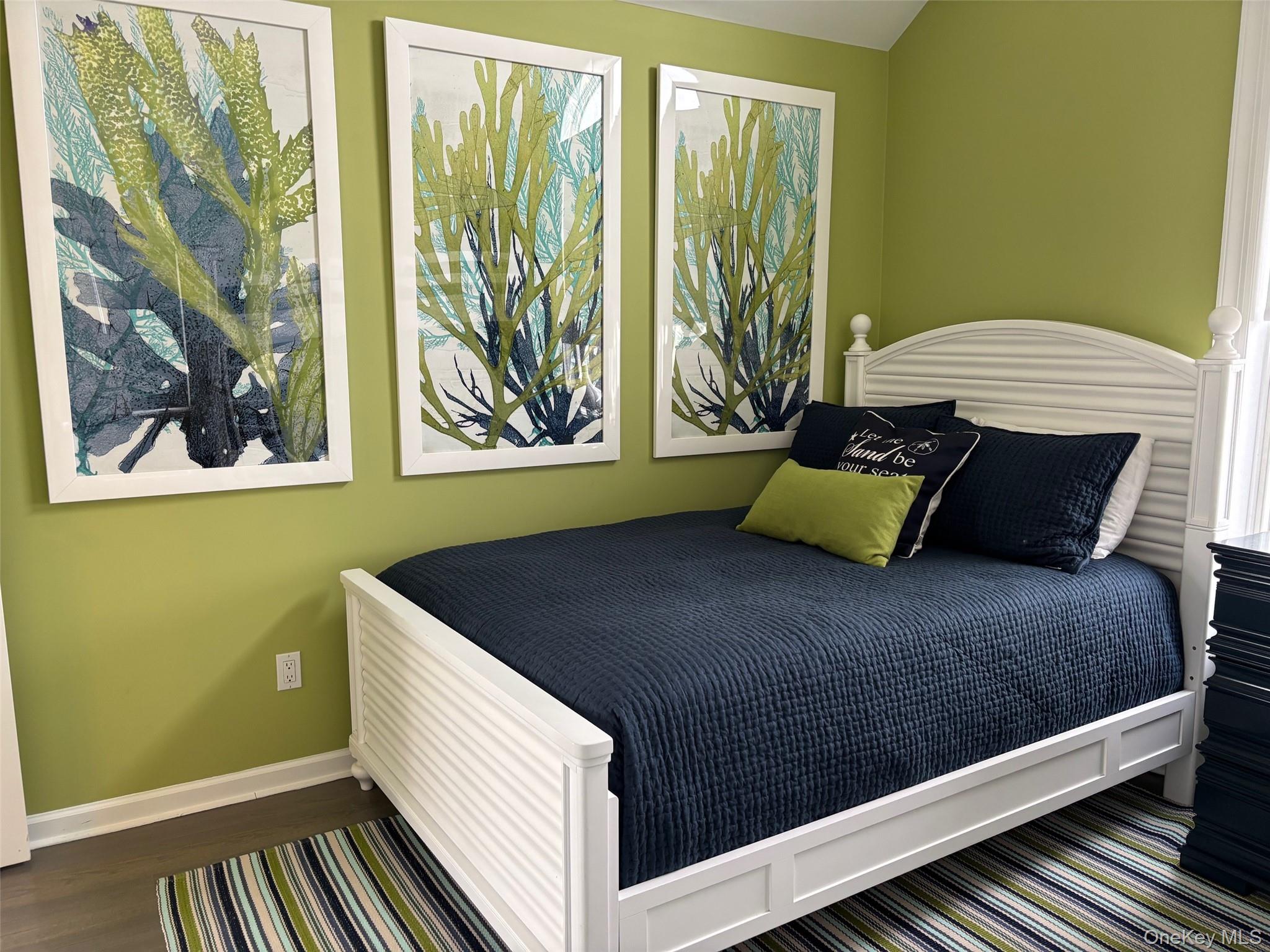 939 Dune Road West Hampton Dunes, NY 11978 - Photo 20 of 25 a bedroom with a bed and window