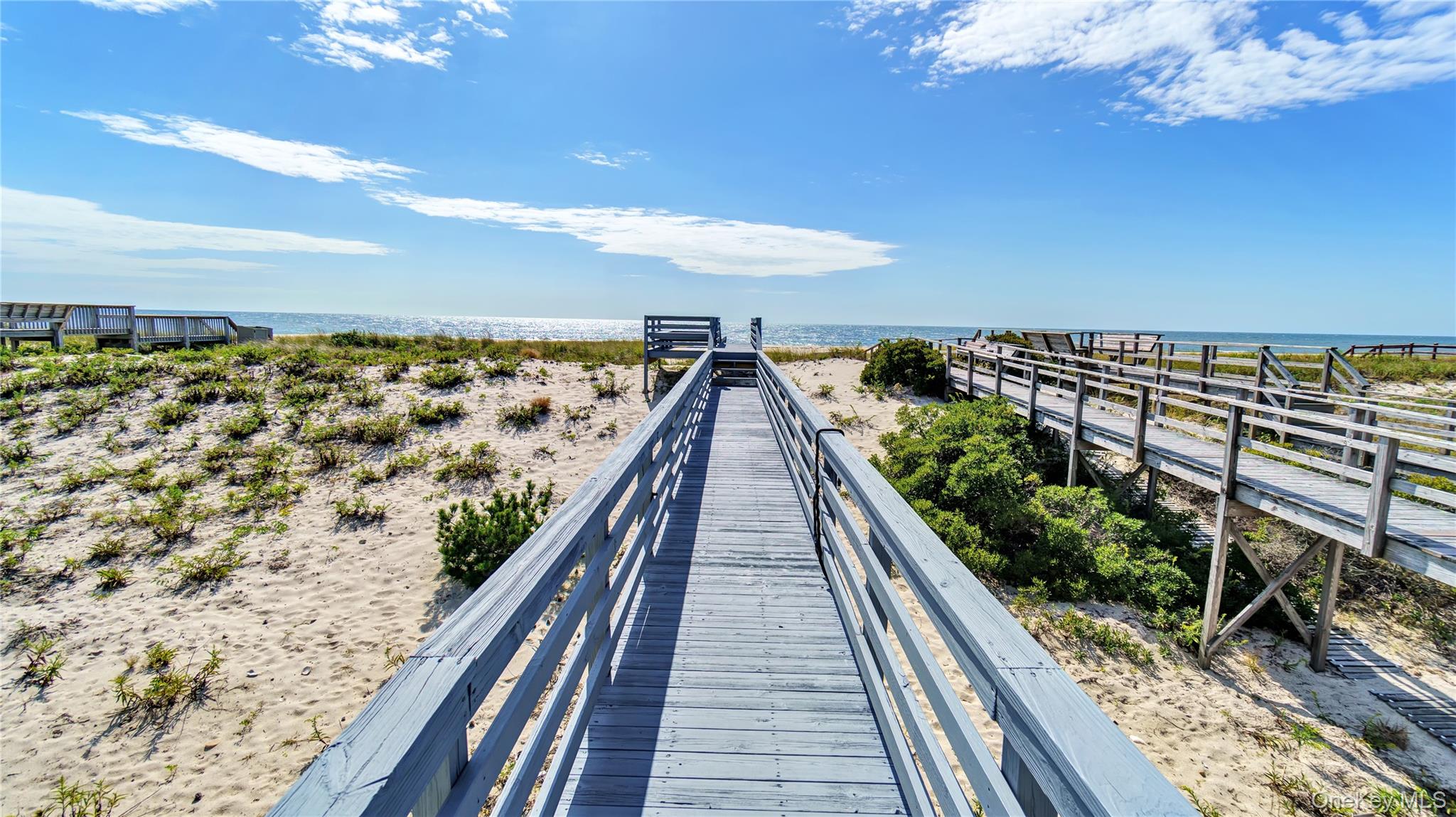 939 Dune Road West Hampton Dunes, NY 11978 - Photo 2 of 25 a view of balcony with wooden floor