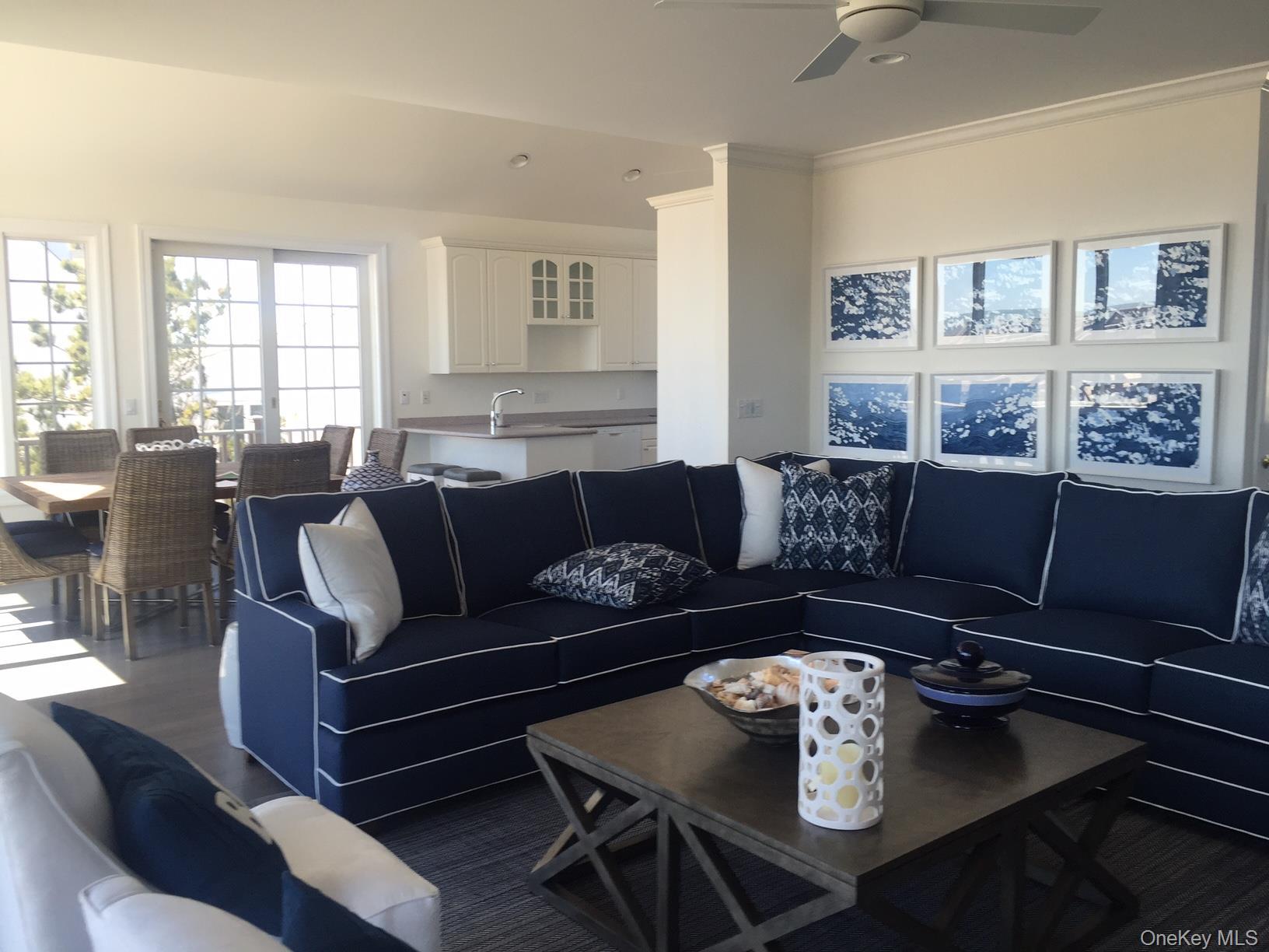 939 Dune Road West Hampton Dunes, NY 11978 - Photo 4 of 21 a living room with furniture potted plant and a window