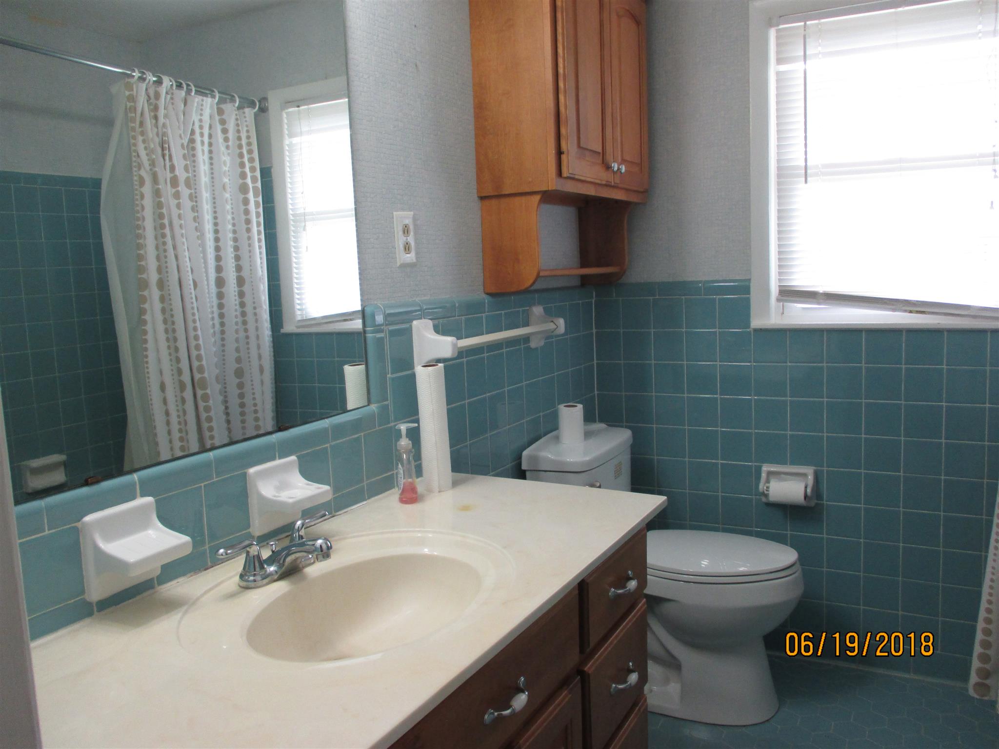 1089 Fall River Road Goodspring, TN 38460 - Photo 17 of 24 a bathroom with a sink a toilet and a mirror