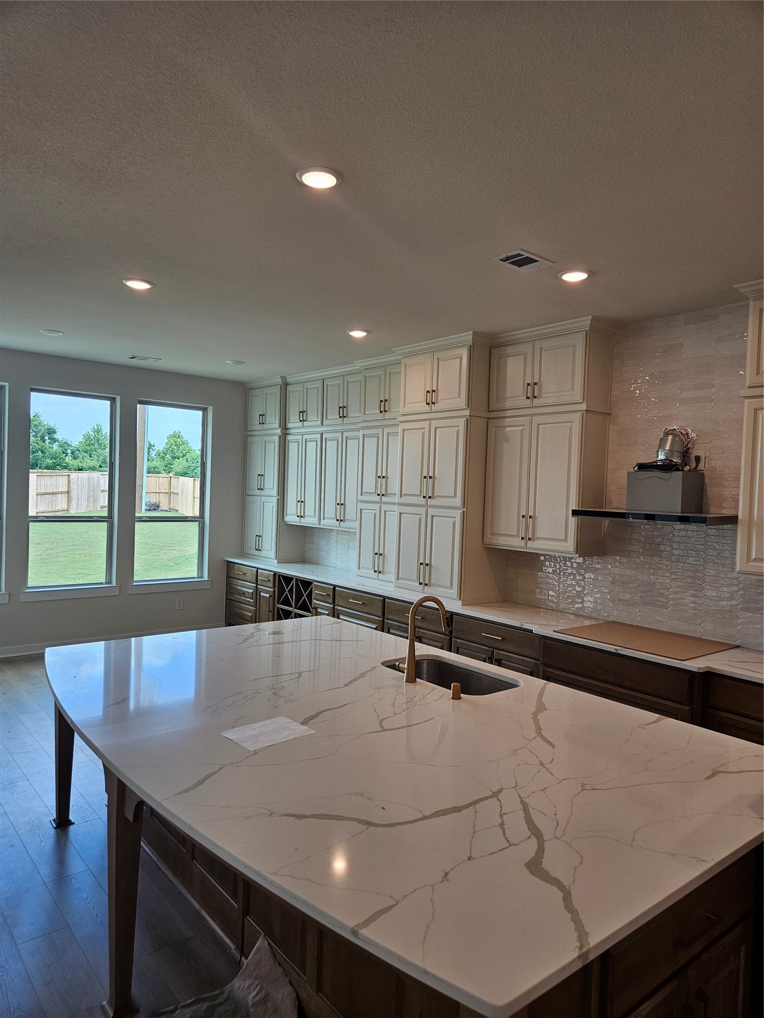 8701 Antelope Cyn Way Manvel, TX 77578 - Photo 4 of 32 a view of a kitchen with kitchen island a sink dishwasher a stove and a refrigerator with wooden floor