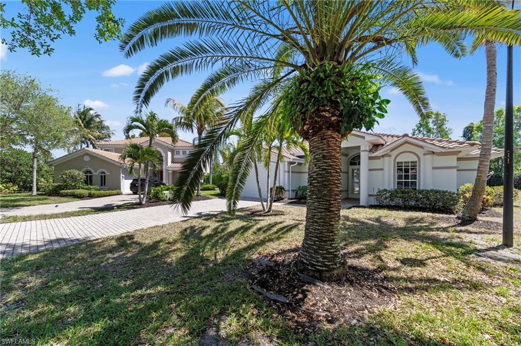 9623 Springlake Circle Estero, FL 33928 - Photo 3 of 47 a view of a house with a tree in the yard