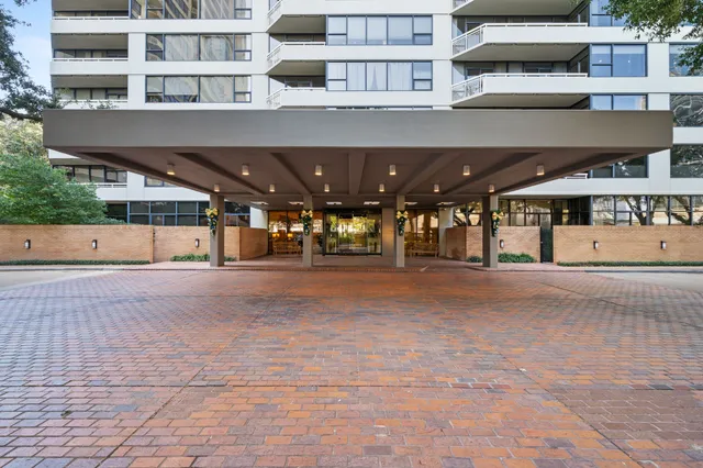 a bathroom with a granite countertop sink a toilet and a bathtub