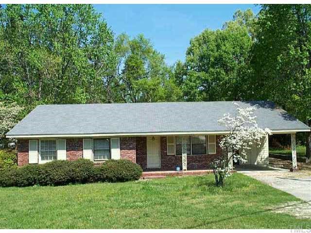 3905 Marsh Creek Road Raleigh, NC 27604 - Photo 1 of 1 a front view of a house with a yard and porch