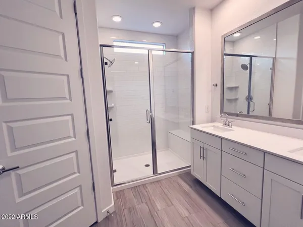 a bathroom with a shower and a curtain