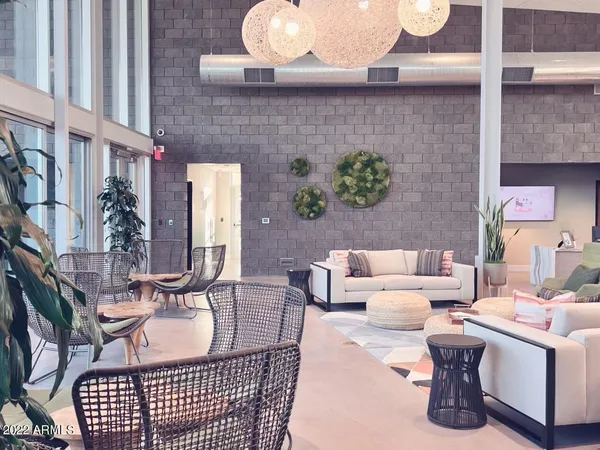 a view of a patio with a table and chairs and a fire pit