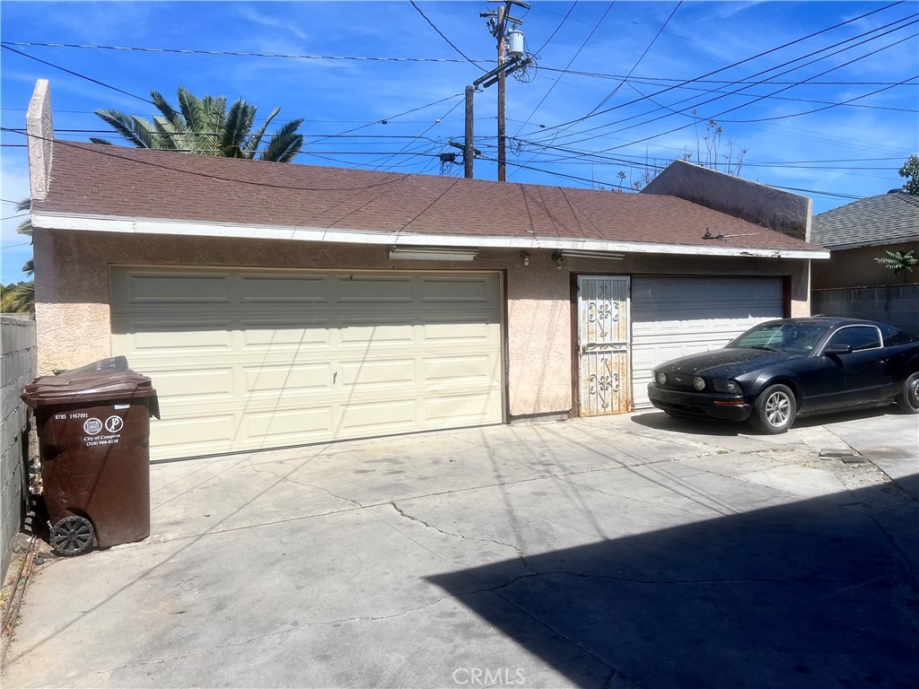 1009 East Stockton Street Compton, CA 90221 - Photo 13 of 14 a car parked in front of a house