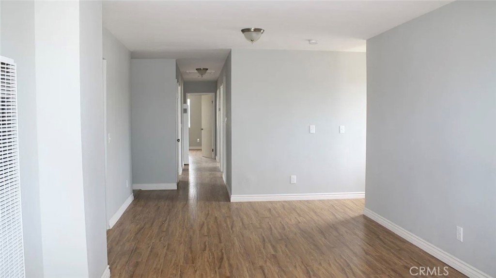 1009 East Stockton Street Compton, CA 90221 - Photo 5 of 14 a view of hallway with wooden floor