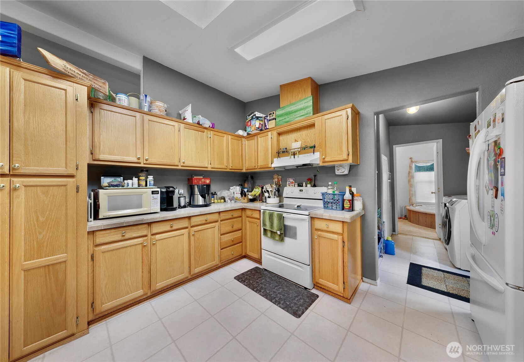 7928 Portal Way Custer, WA 98240 - Photo 20 of 39 a kitchen with stainless steel appliances granite countertop a refrigerator and microwave