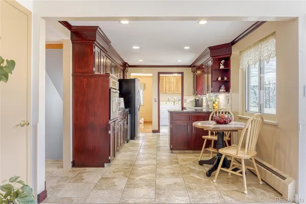 a dining room with furniture and window