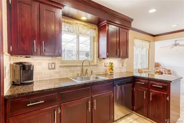 a kitchen with a sink and a window