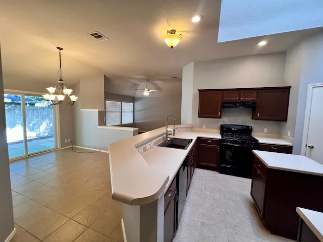 a room with a bed and a television