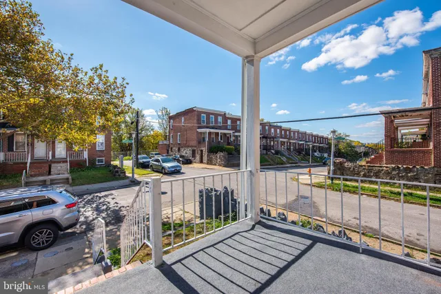 a view of a balcony with wooden floor