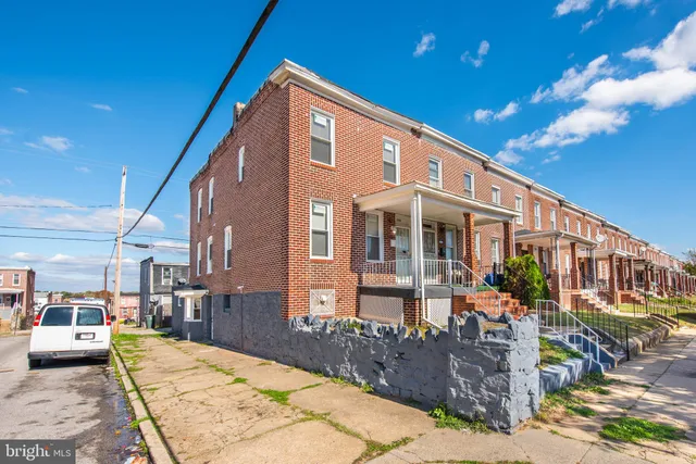 a front view of a house with yard