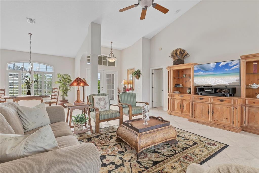 42 Medalist Lane Rotonda West, FL 33947 - Photo 12 of 61 a living room with furniture and a kitchen area