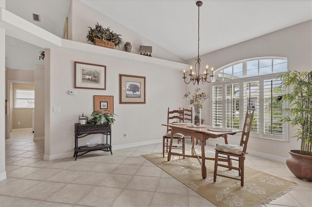 42 Medalist Lane Rotonda West, FL 33947 - Photo 23 of 61 a view of a livingroom with furniture window and wooden floor