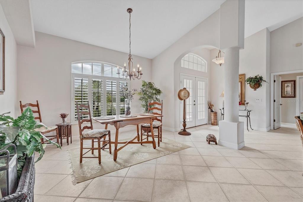42 Medalist Lane Rotonda West, FL 33947 - Photo 24 of 61 a view of a livingroom with furniture window and outside view