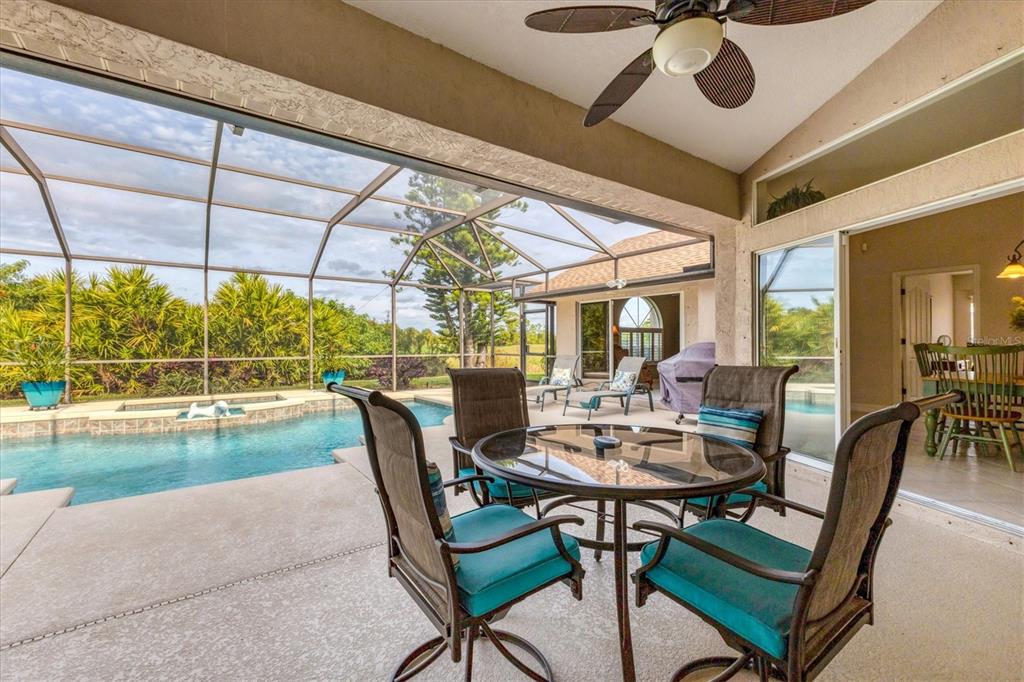 42 Medalist Lane Rotonda West, FL 33947 - Photo 37 of 61 a view of a dining room with furniture window and outside view