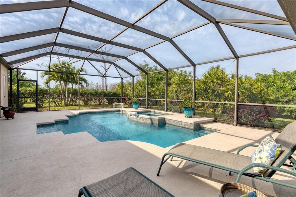 42 Medalist Lane Rotonda West, FL 33947 - Photo 41 of 61 a view of a swimming pool with a patio