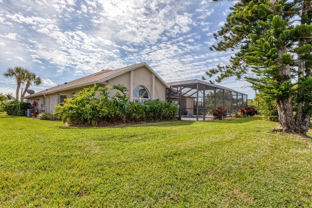 42 Medalist Lane Rotonda West, FL 33947 - Photo 42 of 61 a front view of a house with garden