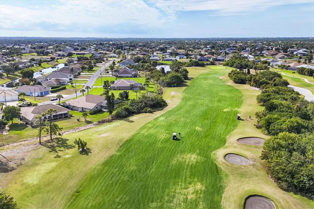 42 Medalist Lane Rotonda West, FL 33947 - Photo 46 of 61 an aerial view of residential houses with outdoor space