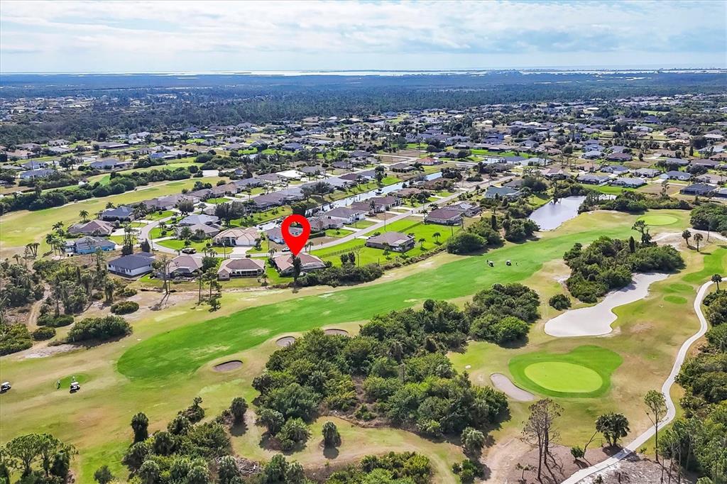 42 Medalist Lane Rotonda West, FL 33947 - Photo 48 of 61 an aerial view of a houses with a swimming pool