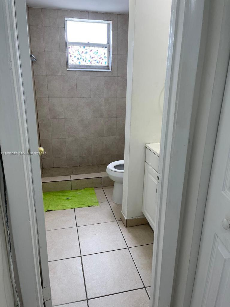 1100 Northeast 1st Court, Unit 106 Hallandale Beach, FL 33009 - Photo 15 of 16 a bathroom with a sink and a toilet