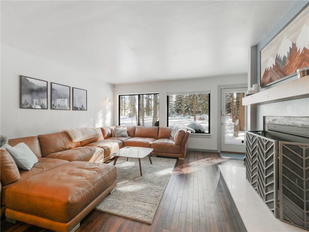 1928 Soda Ridge Road, Unit 1225 Keystone, CO 80435 - Photo 1 of 33 a living room with furniture and a fireplace