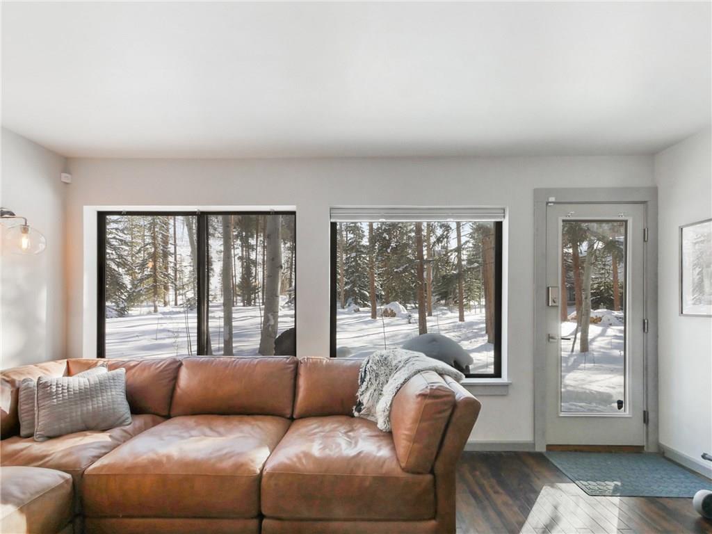1928 Soda Ridge Road, Unit 1225 Keystone, CO 80435 - Photo 2 of 33 a living room with furniture and large windows