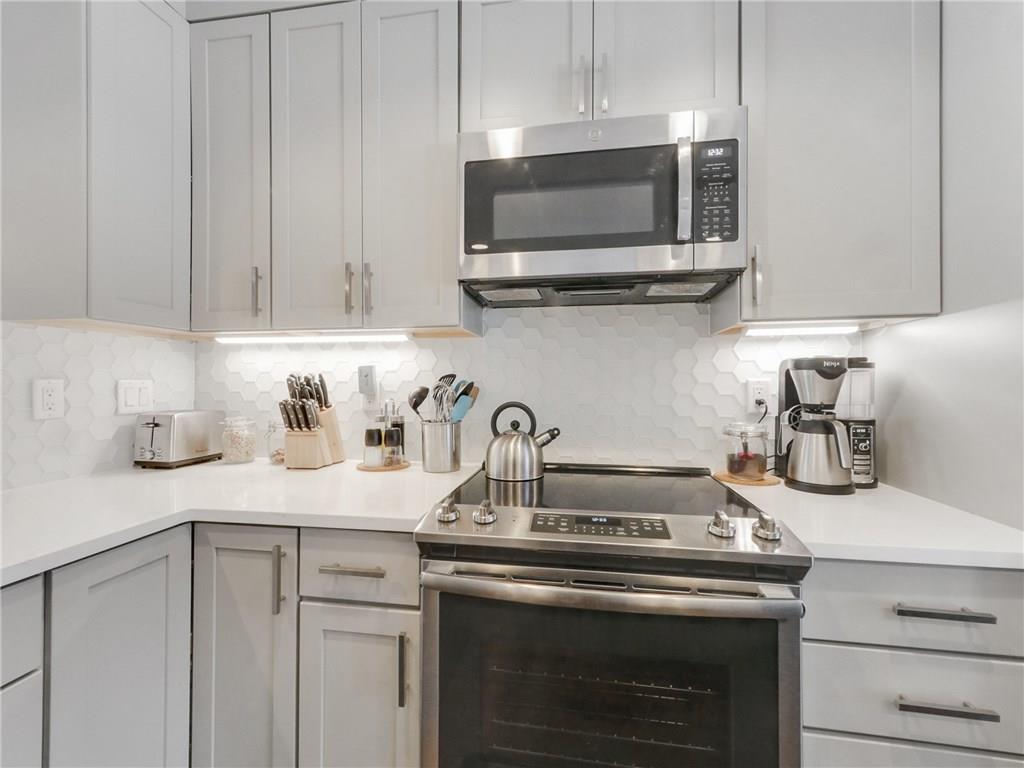 1928 Soda Ridge Road, Unit 1225 Keystone, CO 80435 - Photo 11 of 33 a kitchen with a sink and a stove top oven