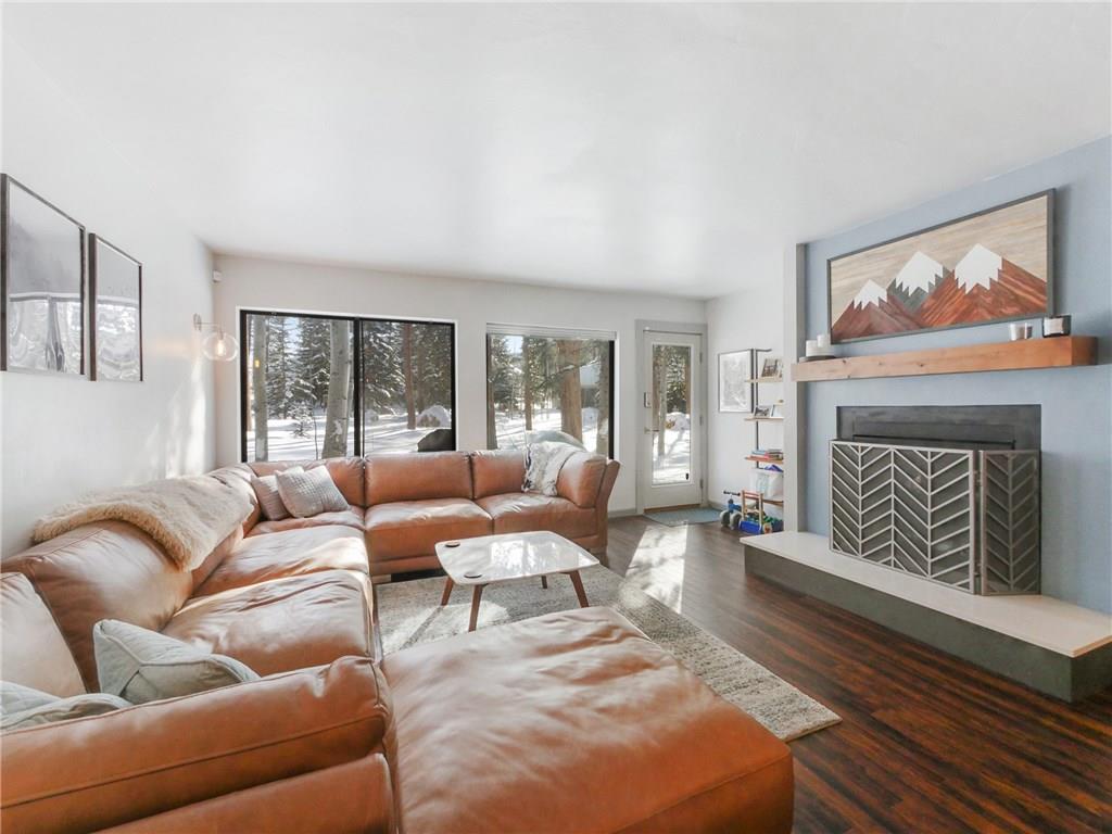 1928 Soda Ridge Road, Unit 1225 Keystone, CO 80435 - Photo 12 of 33 a living room with furniture a large window and a fireplace